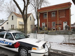 A Windsor police cruiser at 818 Langlois Ave. the day after a home invasion that turned into a shooting on Dec. 9, 2013. (Dan Janisse / The Windsor Star)