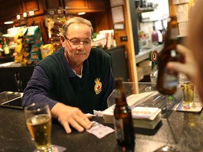 Dereck Willar serves up a drink at the Royal Canadian Legion Branch 255, Friday, March 20, 2015.  The legion is in danger of closing because of a dwindling membership. DAX MELMER/The Windsor Star