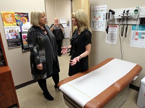 Deputy Premier Deb Matthews is taken on a tour by nurse practitioner, Shelley Raymond during a funding announcement at the Essex County Nurse Practiioner-Led Clinic in Windsor on March 27, 2015.  (TYLER BROWNBRIDGE/The Windsor Star)