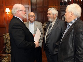 Essex County mayors John Paterson, left, Gary McNamara, Tom Bain and Ron McDermott chat before meeting with other mayors at Willistead Manor in Windsor on Tuesday, March 10, 2015. The meeting represented the first time since the last election all the mayors have met.        (TYLER BROWNBRIDGE/The Windsor Star)