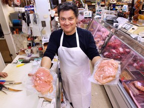 WINDSOR, ON. MARCH 24, 2015. Domenic Giglio of Giglio's Market shows a Canadian-made mortadella, left, and Italian-made one at his Windsor store. Italian food officials are on a trade mission to Canada to promote Italian-made foods over imitations made in Canada.   (DAN JANISSE/The Windsor Star)