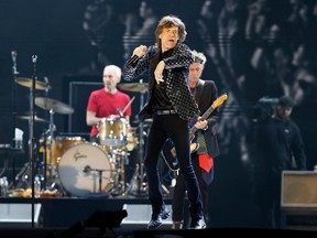 FILE - This Feb. 26, 2014 file photo shows Mick Jagger and the Rolling Stones performing during their concert at Tokyo Dome in Tokyo. The band has announced that they will kick off their new 15-city North American stadium tour (AP Photo/Shizuo Kambayashi, File)  The rock band announced a 15-city stadium tour Tuesday, March 31, 2015, that will kick off May 24 in San Diego.  Other stops include Columbus, Ohio; Minneapolis, Minnesota; Dallas, Texas; Atlanta, Georgia; Orlando, Florida; and Nashville, Tennessee. (AP Photo/Shizuo Kambayashi)