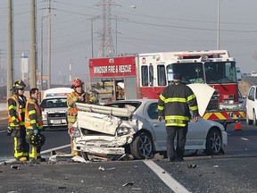 Windsor firefighters are shown at accident Monday, March 9, 2015, in the eastbound lanes of E.C. Row expressway near Lauzon Parkway. The accident occurred at approximately 9:30 a.m. and the driver of the car was taken to hospital with non-life threatening injuries. (DAN JANISSE/ The Windsor Star)
