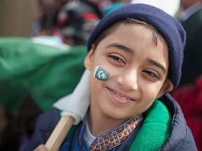 Nabeel Naqvi, 8, sports a Pakistani flag on his cheek during a flag raising ceremony celebrating Pakistani Day at City Hall, Sunday, March 29, 2015.   (DAX MELMER/The Windsor Star)