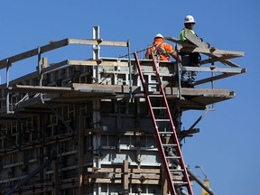Construction crews continue to work on the parkway project in Windsor on Tuesday, March 24, 2015. The contractor is facing heavy fines after missing the January 1st deadline.              (TYLER BROWNBRIDGE/The Windsor Star)