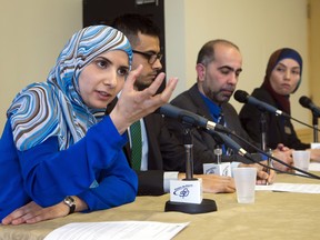 Vice-president of the Canadian Muslim Forum, Kathy Malas, left to right, speaks to reporters as Sameer Zuberi, Samer Majzoub, and Samah Jabbar look on at a news conference in Montreal on Friday, February 20, 2015. The Muslim organizations stated their willingness to help combat radicalization in Quebec. THE CANADIAN PRESS/Ryan Remiorz