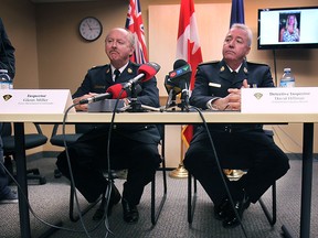 Ontario Provincial Police Inspector Glenn Miller (L) and Det. Inspector David Hillman are shown Thursday, March 12, 2015, during a media conference regarding the first degree murder charge in the Nancy Quick case. (DAN JANISSE/ The Windsor Star)