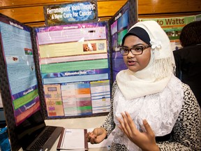 Tasnia Nabil, 14, a grade 9 student at Vincent Massey Secondary School, discusses her project titled Ferromagnetic NanoTherapy: A New Cure for Cancer at the Windsor Regional Science Technology and Engineering Fair at St. Clair College, Saturday, March 28, 2015.  (DAX MELMER/The Windsor Star)