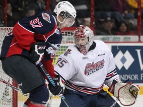 Windsor's Anothony Stefano, left, scrambles for the puck in front of Oshawa goaltender, Ken Appleby, during OHL action between the Windsor Spitfires and the visiting Oshawa Generals at the WFCU Centre, Sunday, March 8, 2015.  (DAX MELMER/The Windsor Star)