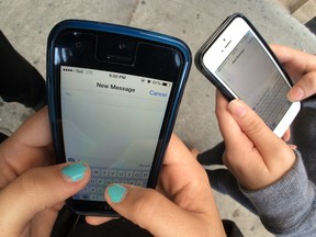 Teens ready to text are shown in this September 2014 file photo. (Rick Dawes / The Windsor Star)