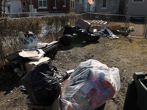 Bags and boxes full of garbage in an alley in the Walkerville area on Mar. 24, 2015. (Tyler Brownbridge / The Windsor Star)
