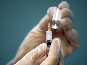 A nurse prepares a vaccine shot. (Windsor Star files)