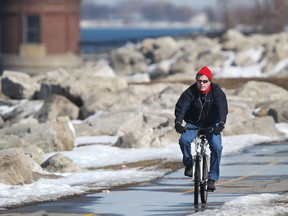 A man rides his bike along Windsor's riverfront, Monday, March 9, 2015.  (DAX MELMER/The Windsor Star)