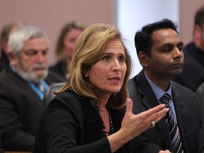 Sandra Pupatello, CEO at WindsorEssex Economic Development Corporation,  smiles as she listens to Windsor councillor Hilary Payne speak during council session on March 23, 2015. (JASON KRYK/The Windsor Star)