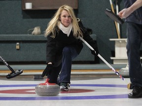 The Star's Kelly Steele tries her hand at curling recently at Roseland Golf and Curling Club. (JASON KRYK / The WIndsor Star)