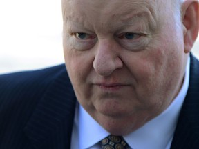Suspended senator Mike Duffy arrives to the courthouse in Ottawa on Monday, April 13, 2015. Duffy is facing 31 charges of fraud, breach of trust, bribery, frauds on the government related to inappropriate Senate expenses. THE CANADIAN PRESS/Sean Kilpatrick