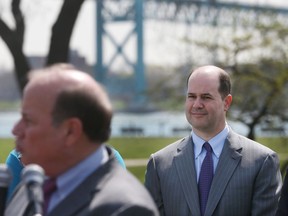 Ambassador Bridge Companies Matthew Moroun, right, looks on as Detroit Mayor Mike Duggan anounces a new deal between the City of Detroit and the bridge company on Wednesday, April 29, 2015 in Detroit. (Carlos Osorio/The Associated Press)