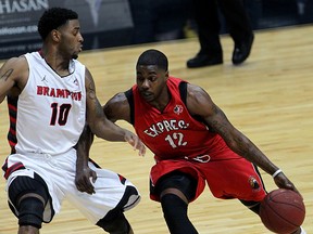 Windsor Express Tony Bennett drives against Brampton A's Ashton Brown in second half of NBL Canada Conference Finals action from WFCU Centre, April 7, 2015. (NICK BRANCACCIO/The Windsor Star)