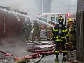 Windsor firefighters from several stations converge to battle a raging fire in the 1500 block of  Gladstone Ave. April 7, 2015.  Windor Fire said possible chemicals could be involved in the blaze at Nunes Janitorial and are advising the public to stay clear of the area. (NICK BRANCACCIO/The Windsor Star)