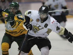 Vipers Korey Morgan skates in front of Elmira Sugar Kings Chad Herron during first period of 2015 Sutherland Cup semi-finals from Vollmer Centre Friday April 10, 2015. (NICK BRANCACCIO/The Windsor Star)