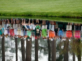 Augusta
Patrons are reflected in the water during a practice round prior to the start of the 2015 Masters Tournament at Augusta National Golf Club on April 8, 2015 in Augusta, Georgia.