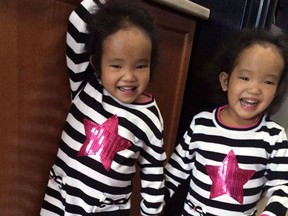 Three-year-old Binh Wagner, left, from Kingston, Ont., has received a liver transplant two months after her twin sister Phuoc, right, underwent the same surgery to combat a potentially fatal genetic disorder. Binh and Phuoc Wagner are shown in an undated handout photo. THE (CANADIAN PRESS/Wagner family)