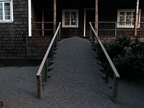 The entrance of a house is covered with ash from the eruption of the Calbuco volcano in Puerto Varas, Chile, Thursday, April 23, 2015. Due to the eruption the Chilean government has declared a state of emergency in the region surrounding the volcano, including the cities of Puerto Montt and Puerto Varas, and handed over civil authority to the armed forces.