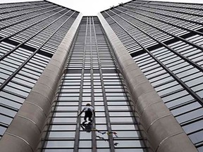 Alain Robert, also known as the French Spiderman, climbs the Montparnasse tower a 210-metre (689 ft) office skyscraper located in the Montparnasse area of Paris, France, Tuesday, April 28, 2015. Robert decided to climb in solidarity with the victims of the Saturday's earthquake in Nepal.