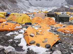 n this photograph taken on April 26, 2015, rocks are kept over flattened tents at Everest Base Camp, to cover the bodies of some of the people that died a day earlier as an earthquake triggered avalanche crashed through parts of the base camp killing scores of people.  Rescuers faced a race against time on April 29, to find survivors of a mammoth earthquake that killed more than 5,000 people when it through Nepal five days ago and devastated large parts of one of Asia's poorest nations.   AFP PHOTO/ROBERTO SCHMIDTROBERTO SCHMIDT/AFP/Getty Images