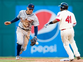 Second baseman Ian Kinsler #3 of the Detroit Tigers bobbles the throw on a ground ball hit Yan Gomes #10 as Carlos Santana #41 of the Cleveland Indians reaches second during the sixth inning by at Progressive Field on April 11, 2015 in Cleveland, Ohio.(Photo by Jason Miller/Getty Images)