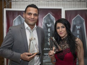 WESPY Male and Female Athlete of the Year, Samir Adnan El-Mais, left, and Randa Markos, pose with their trophies at the WESPY Awards at the Caboto Club, Monday, April 13, 2015.  (DAX MELMER/The Windsor Star)