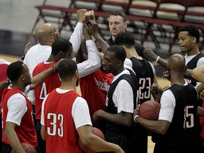 Windsor Express head coach Bill Jones, top left, gets Express players together for a team salute near the end of practice at WFCU Centre, April 16, 2015. (NICK BRANCACCIO/The Windsor Star)