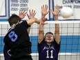 Villanova's Dante Civiero, left, spikes the ball against Kingsville's Austin Wild during senior boys volleyball action at Villanova. (JASON KRYK/ The Windsor Star)