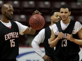 Windsor Express Quinnel Brown, left, displays his ball handling skills with teammates at WFCU Centre, April 16, 2015. Express prepare for Game 2 of NBL Canada championship. (NICK BRANCACCIO/The Windsor Star)