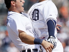 Detroit's Jose Iglesias, right, chest-bumps Ian Kinsler after hitting an RBI single to defeat the Chicago White Sox 2-1 in the ninth inning at Comerica Park Friday. (Photo by Duane Burleson/Getty Images)