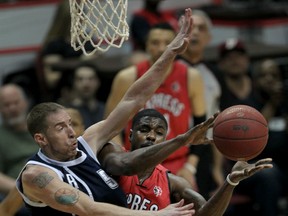 Windsor's Tony Bennett, right, runs into stiff defence by Halifax Rainmen Forrest Fisher, left, in first half action of NBL Canada championship at WFCU Centre Friday April 17, 2015. (NICK BRANCACCIO/The Windsor Star)