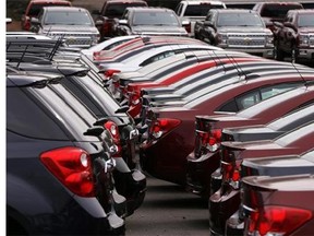In this Monday, March 23, 2015 photo, Chevrolet vehicles are on display at a dealership in Gibsonia, Pa. Automakers release vehicle sales for March on Wednesday, April 1, 2015. (AP Photo/Gene J. Puskar)