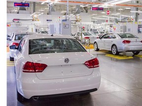 In this July 12, 2013, photo, Passat sedans are lined up to be tested at the Volkswagen plant in Chattanooga, Tenn.