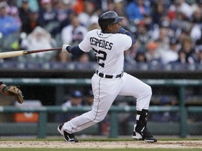 Detroit Tigers' Yoenis Cespedes, right, connects for a grand slam during the first inning of a baseball game against the Chicago White Sox, Sunday, April 19, 2015, in Detroit. (AP Photo/Carlos Osorio)
