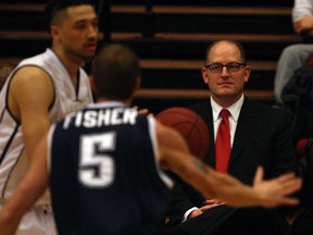 Windsor Mayor Drew Dilkens, right, watches play between Windsor Express and Halifax Rainmen in NBL of Canada at The Colosseum Caesars Windsor January 21, 2015. (NICK BRANCACCIO/The Windsor Star)