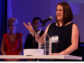 Amy Szewczuk, right, of Amy's Helping Hands accepts Mid-sized company of the Year award during 2015 Business Excellence Awards Gala in Augustus Ballroom at Caesars Windsor Wednesday April 22, 2015. (NICK BRANCACCIO/The Windsor Star)