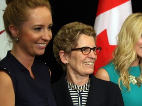 WINDSOR, ONT. May 22, 2013. Premier Kathleen Wynne, centre, poses with Sarah Davidson, left, and Yvonne Pilon, co-chairs of Youth Retention and Attraction Task Force during the announcement of Ontario Trillium Foundation grant of $100,000 toward the WE Explore Project which supports young business leaders in engaging the community.  (NICK BRANCACCIO/The Windsor Star) ORG XMIT: 00021A