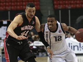 Halifax's Cliff Clinkscales, right, drives around Windsor's Ryan Anderson during Game 3 of the NBL of Canada final at the Scotiabank Centre in Halifax Thursday. (Jeff Harper/Metro)