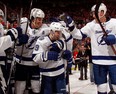 Tampa Bay’s Tyler Johnson, centre, celebrates his game winning overtime goal with Brian Boyle, left, and Andrej Sustr #62 during Game 4 of the Eastern Conference quarter-final at Joe Louis Arena Thursday.