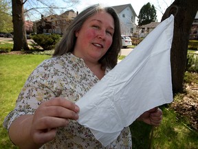 Debby Grant with white flag campaign organized by Windsor Essex Community Right to Know association.  The white cotton flags will be planted in the Remington Park neighbourhood to collect air samples.  (NICK BRANCACCIO/The Windsor Star)