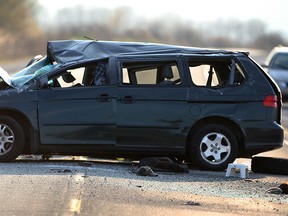 OPP investigate along with coroner on Hwy. 3 west of Morse Road following a double fatal accident involving a Honda minivan April 29, 2015. (NICK BRANCACCIO/The Windsor Star)