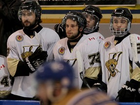 LaSalle’s Nikko Sablone, from left, Connor Rosaasen, Dalton Langlois and Brett Langlois watch the play from the bench during the third period against Caledonia in Game 4 of the Sutherland Cup final at the Vollmer Centre. (NICK BRANCACCIO/The Windsor Star)