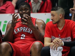 Windsor Express DeAndre Thomas, left, and Ryan Anderson converse on the bencg in battle againast Halifax Rainmen in NBL Canada Championship Game 6 at WFCU Centre, Tuesday April 28, 2015. Express were down 12 points early in the game. (NICK BRANCACCIO/The Windsor Star)