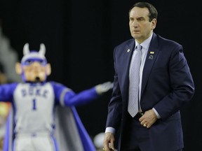 Duke head coach Mike Krzyzewski watches the play against Gonzaga during the first half at the NCAA Tournament Sunday in Houston. (AP Photo/David J. Phillip)