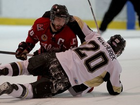 Flyers captain Mitchell Amante, top, tangles with LaSalle's Mark Manchurek during the first period of Junior B playoff action at the Vollmer Centre Wednesday. (NICK BRANCACCIO/The Windsor Star)